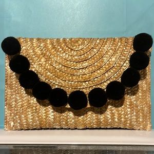 Beautiful straw clutch with Pom poms